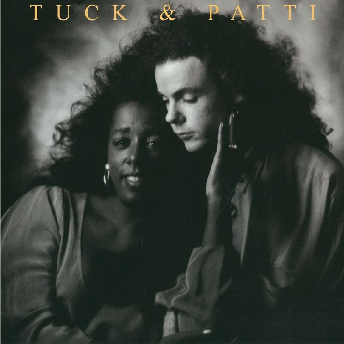 Tuck & Patti – Love Warriors cover artwork